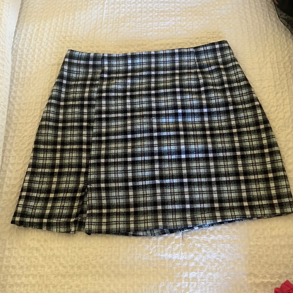 Girls skirt, black pants and plaid pants.